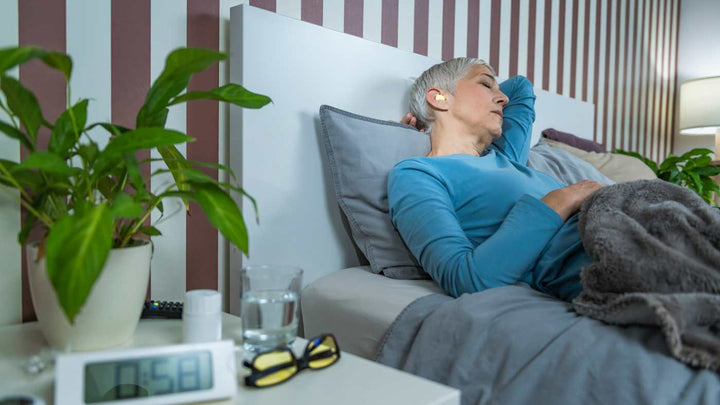 Woman sleeping with Flents Ear Plugs
